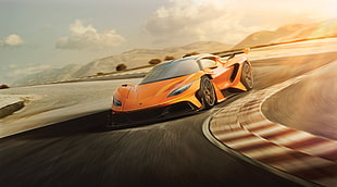 orange sports car on road during daytime