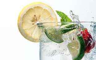 yellow lemon on clear glass bottle with liquid