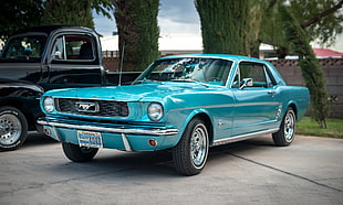 teal Ford Mustang Grande