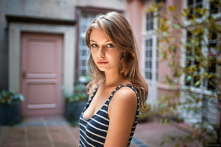 woman wearing black and white striped tank top