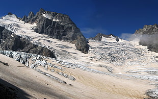 black rock formation with sands