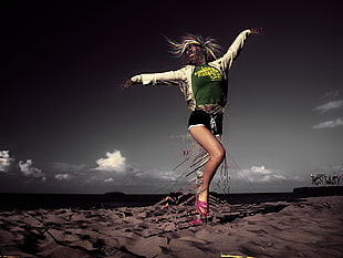 woman wearing white jacket with green shirt and black shorts stretching her hands to the air HD wallpaper
