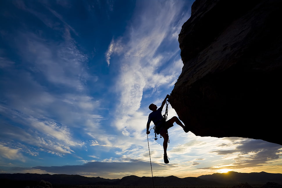 Silhouette of man climbing on mountain during daytime HD wallpaper ...