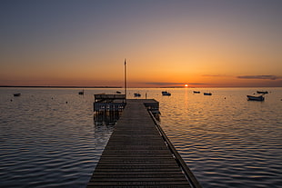 photo of deck and boats during sunset HD wallpaper