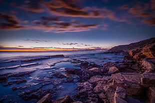 beach coast line near rock formation HD wallpaper