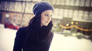woman wearing grey beanie taking photo in shallow focus photography with mild vignette HD wallpaper