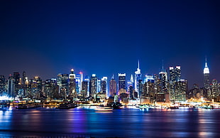 high rise concrete building photo, cityscape, night, New York City, Manhattan