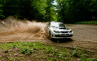 white and black Subaru Impreza rally car drifting soil pavement HD wallpaper