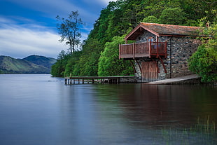 house near body of water during daytime photo HD wallpaper
