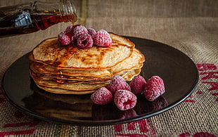 pancake with raspberry on round brown plate with maple syrup HD wallpaper