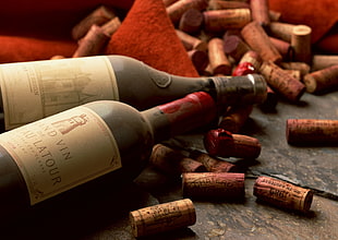 beige labeled bottles with corks on brown wooden surface HD wallpaper