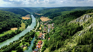 top view of village beside river between mountains, valley view