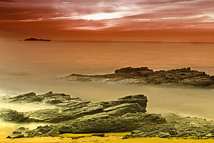 Sea shore with body of water, orange