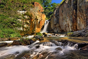 waterfalls near cliff during daytime HD wallpaper