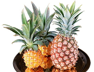 three pineapples on black tray HD wallpaper