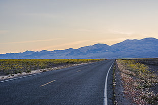 photography of gray asphalt road near hills during day time HD wallpaper