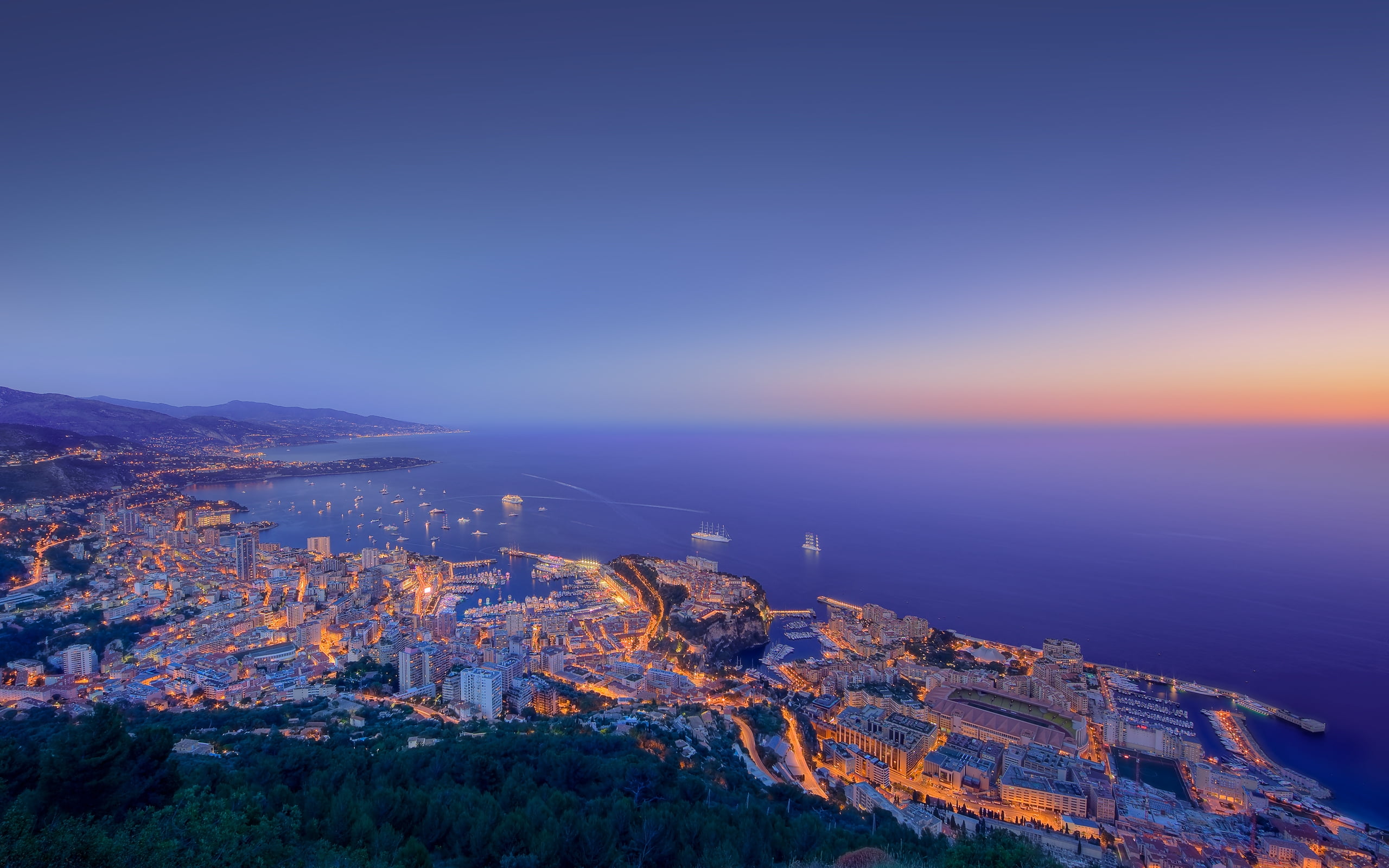 aerial photography of city beside body of water on night