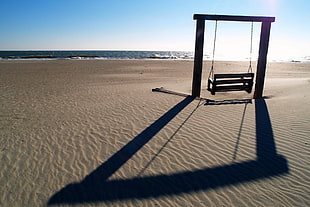 swing chair in the middle of a desert HD wallpaper