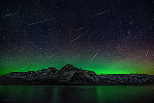 green and black wooden table, stars, aurora  borealis, mountains, water HD wallpaper