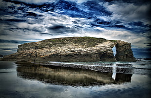 panoramic photography of rock formation under blue and white sky HD wallpaper