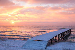 white wooden dock beside the beach during sunset HD wallpaper