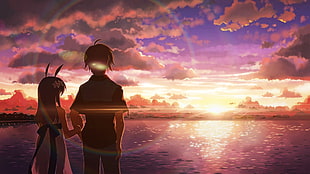 girl and boy stands near sea during golden hours HD wallpaper