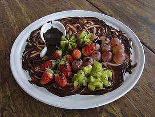 strawberry, grapes and kiwi fruits on top of white plate covered in chocolate HD wallpaper