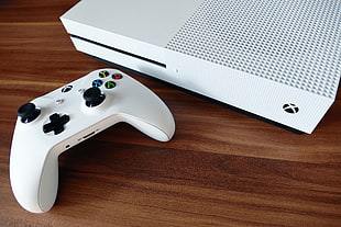 white Xbox One with game pad on brown wooden table top HD wallpaper