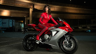 woman riding red and silver sports bike HD wallpaper
