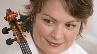 woman holding a violin photo