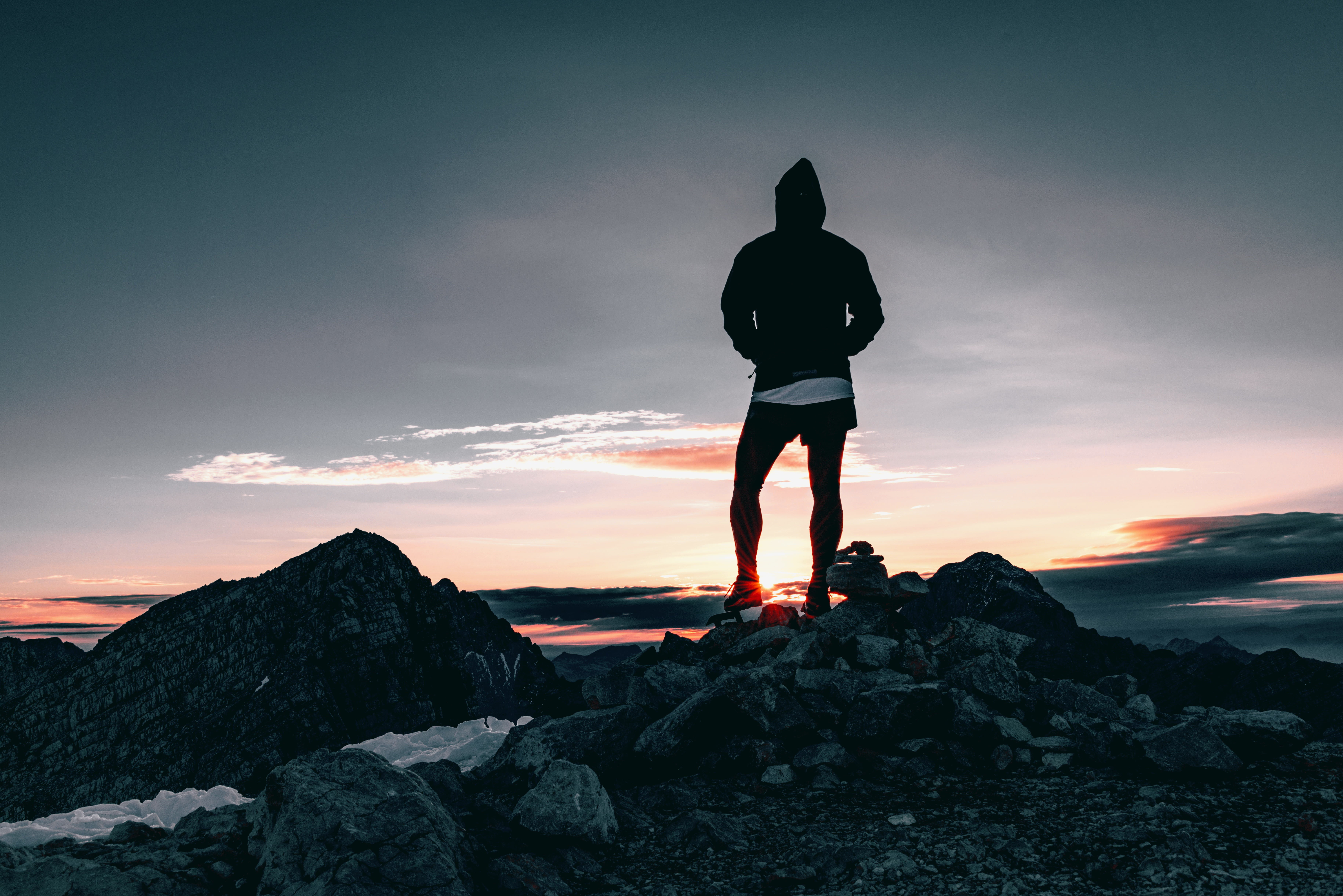Man In Black Hoodie Standing On Stone At Daytime Hd Wallpaper Wallpaper Flare Enjoy and share your favorite beautiful hd wallpapers and background images. wallpaperflare