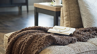 book on brown fur comforter HD wallpaper