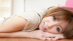 brown hair woman wearing brown shirt