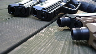 four black-and-brown semi-automatic pistols HD wallpaper
