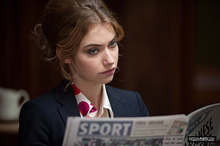 woman reading newspaper