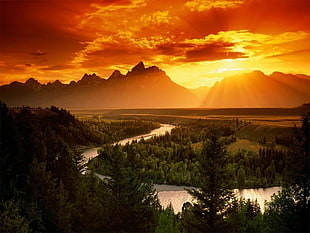 lake between trees near mountain range under golden hour, landscape, sky, clouds