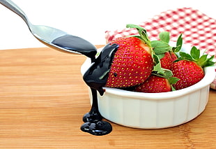 strawberries on white ceramic bowl topped with chocolate syrup HD wallpaper