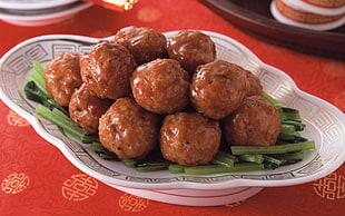 brown meatballs in white ceramic bowl