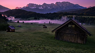 brown wooden shed near lake and glacier mountain during golden hour HD wallpaper