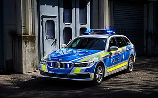 blue and white BMW police car sedan HD wallpaper