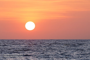 sunset view of blue beach