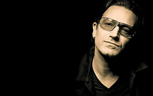 landscape portrait photo of man wearing black framed sunglasses and black v-neck shirt HD wallpaper