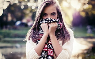 woman smelling black textile