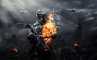 man holding a gun with a fire on his right arm HD wallpaper