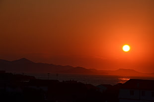 silhouette of mountain during suntset