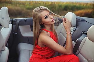 woman wearing red halter dress sitting inside convertible car HD wallpaper