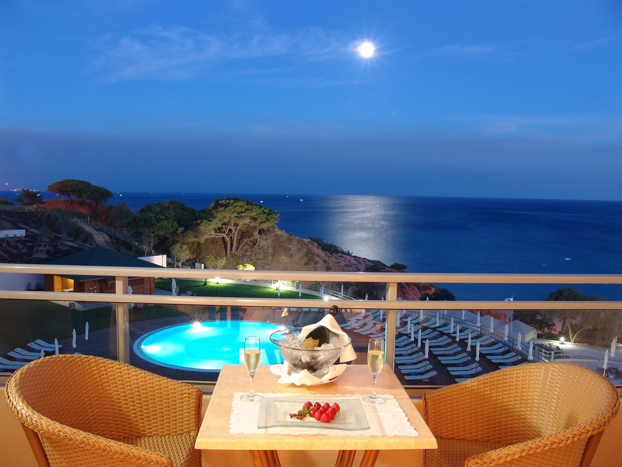 landscape photography of veranda overlooking blue body of water