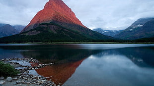 mountain near body of water