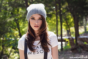 selective focus photo of woman wearing white and black top