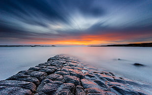time lapse photography of gray rock formation with clouds during golden hou, beadnell HD wallpaper